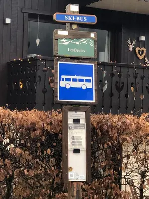 a sign for a bus stop with a bus at Studio - Le D2 du Grand Tetras in Samoëns