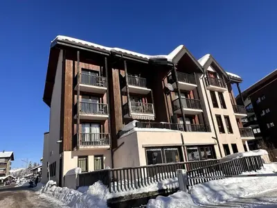 a apartment building with snow in front of it at Studio cosy 4 pers au cœur de la station, proche des pistes et commerces - FR-1-572-268 in Arâches-la-Frasse