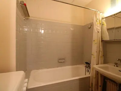 a bathroom with a white tub and a sink at Grand appartement 9 pers, près des pistes, animaux admis - FR-1-687-86 in Arâches-la-Frasse