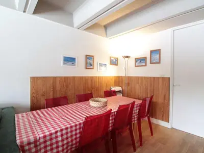 a dining room with a red and white checkered table and chairs at Grand appartement 9 pers, près des pistes, animaux admis - FR-1-687-86 in Arâches-la-Frasse