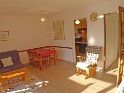 a kitchen and dining room with a table and chairs at T2 à Samoëns, animaux acceptés, parking - FR-1-629-67 in Samoëns