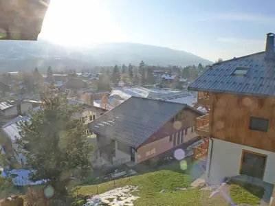 a view of a small town with houses and trees at T2 à Samoëns, animaux acceptés, parking - FR-1-629-67 in Samoëns