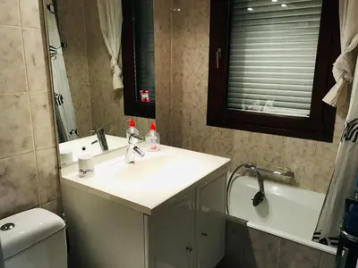 a bathroom with a sink and a toilet and a mirror at Appartement 3 pièces, 6 pers., Samoëns, avec Wifi et Parking - FR-1-629-11 in Samoëns