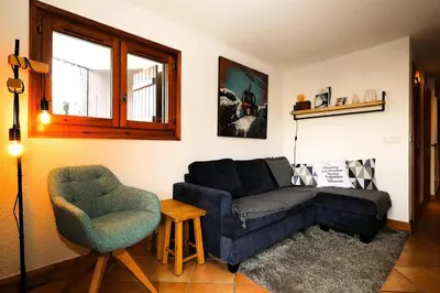 a living room with a couch and a chair at Résidence Les Hauts De Chavants - Hauts de chavants Albert 1er n°1 MAE-6254 in Les Houches