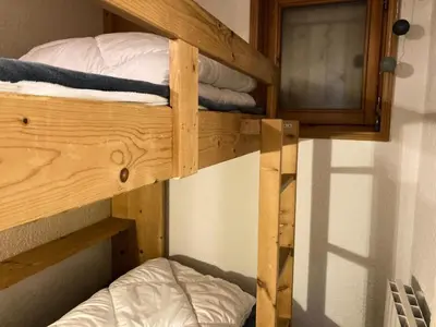 a couple of bunk beds in a room at Résidence Les Hauts De Chavants - Hauts de chavants Albert 1er n°1 MAE-6254 in Les Houches