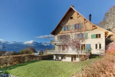 a large house on a hill with a yard at Saint Éloi - Panoramic view - Mont Joly - Central in Saint-Gervais-les-Bains