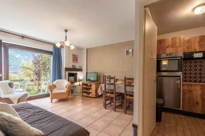 a room with a kitchen and a living room at Le Crétet 2 - Best views of the Mont-Blanc in Chamonix-Mont-Blanc