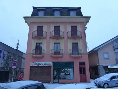 a building with balconies on the side of it at Duplex centre Chamonix pour 6 avec parking et wifi - FR-1-343-240 in Chamonix-Mont-Blanc