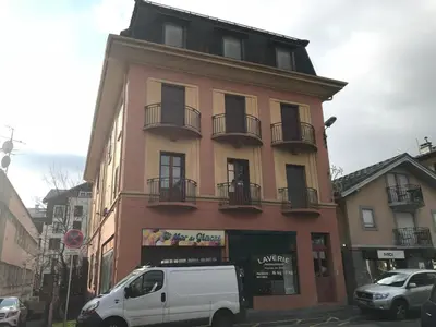 a white van parked in front of a building at Duplex centre Chamonix pour 6 avec parking et wifi - FR-1-343-240 in Chamonix-Mont-Blanc