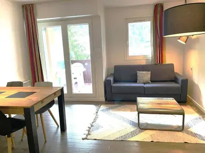 a living room with a couch and a table at Studio à Chamonix avec balcon, 4 personnes - FR-1-343-238 in Chamonix-Mont-Blanc