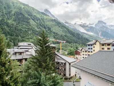 a town in the mountains with a pine tree at Studio à Chamonix avec balcon, 4 personnes - FR-1-343-238 in Chamonix-Mont-Blanc