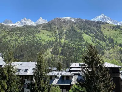 a group of buildings in front of a mountain at Studio à Chamonix avec balcon, 4 personnes - FR-1-343-238 in Chamonix-Mont-Blanc