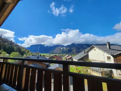 a view of the mountains from a balcony at Atypique T4 lumineux avec vue panoramique, 3 Ch, 6-8 pers, WIFI, parking couvert - FR-1-629-112 in Samoëns