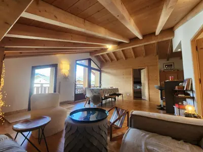 a living room with couches and a table at Atypique T4 lumineux avec vue panoramique, 3 Ch, 6-8 pers, WIFI, parking couvert - FR-1-629-112 in Samoëns
