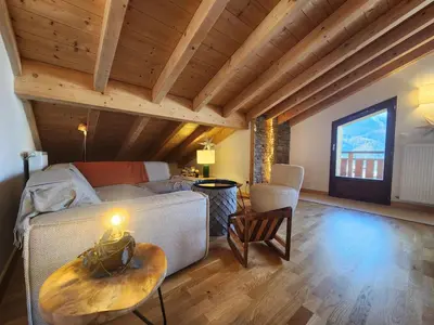 a living room with a couch and a table at Atypique T4 lumineux avec vue panoramique, 3 Ch, 6-8 pers, WIFI, parking couvert - FR-1-629-112 in Samoëns