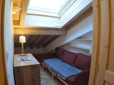 a living room with a couch in a attic at Atypique T4 lumineux avec vue panoramique, 3 Ch, 6-8 pers, WIFI, parking couvert - FR-1-629-112 in Samoëns