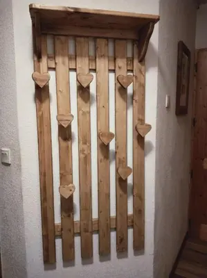 a wooden gate on the wall of a room at LE GRAND TETRAS in Samoëns