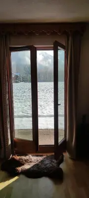 an open window with a view of the water at LE GRAND TETRAS in Samoëns