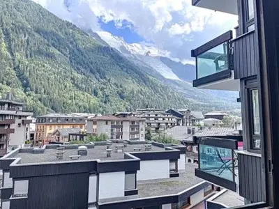 a view from a window of a city with a mountain at STUDIO DENT DU CAIMAN, CHAMONIX hyper CENTRE, PARKING, VUE MONT BLANC in Chamonix-Mont-Blanc