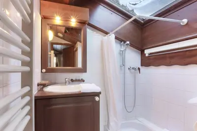 a bathroom with a sink and a shower at Le Goûter - Ski-in ski-out - Indoor Pool in Les Houches