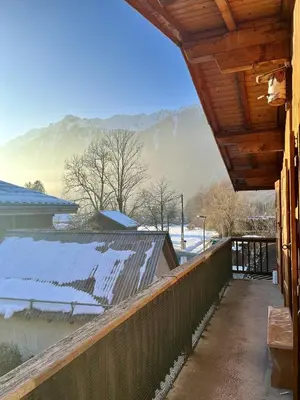 a porch of a house with snow on the roof at Le Chaney - T2 dans chalet - Massif du Mont-Blanc in Chamonix-Mont-Blanc