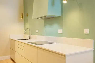 a kitchen with a sink and a counter top at Majestic Alpin - A luxurious apartment with a nordic feel in Chamonix-Mont-Blanc