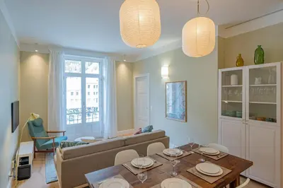 a living room with a couch and a table at Majestic Alpin - A luxurious apartment with a nordic feel in Chamonix-Mont-Blanc