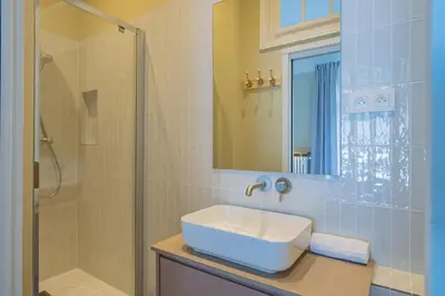 a bathroom with a sink and a shower at Majestic Alpin - A luxurious apartment with a nordic feel in Chamonix-Mont-Blanc