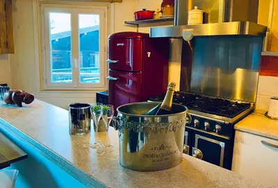 a kitchen counter with a pot on a stove at Appartement 2pieces Hyper Centre Les Houches, proche Chamonix in Les Houches