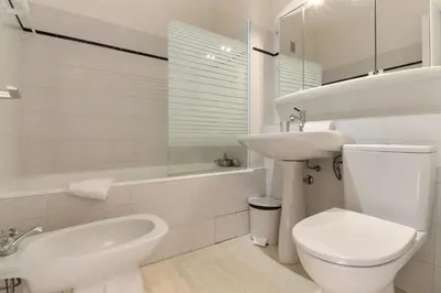 a white bathroom with a sink and a toilet at Makalu - View Mont-Blanc - Chamonix Center -8 pers in Chamonix-Mont-Blanc