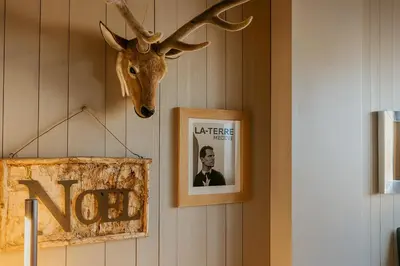 a picture of a deer head hanging on a wall at White Lodges - Megève center on ski slopes in Megève