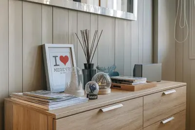 a wooden dresser with items on top of it at White Lodges - Megève center on ski slopes in Megève