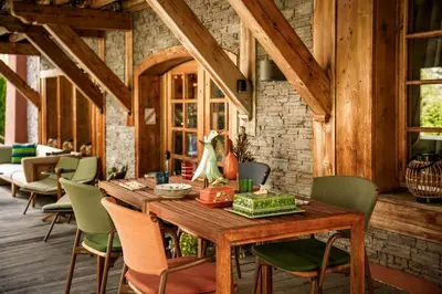 a dining room with a wooden table and chairs at Magic Megève Bois in Demi-Quartier