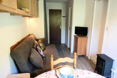 a living room with a couch and a television at Résidence Cristal - Cristal 161 MAE-5824 in Mémontel