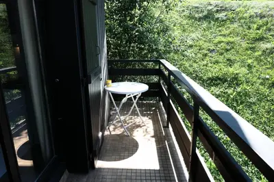 a small stool on the balcony of a house at Résidence Cristal - Cristal 161 MAE-5824 in Mémontel