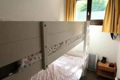 a white bunk bed in a room with a window at Résidence Cristal - Cristal 161 MAE-5824 in Mémontel