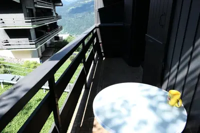 a table on the balcony of a building with a view at Résidence Cristal - Cristal 161 MAE-5824 in Mémontel