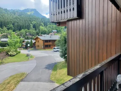 a view from a balcony of a house at Studio avec petit balcon et cheminée - Grand Massif in Les Carroz d'Araches