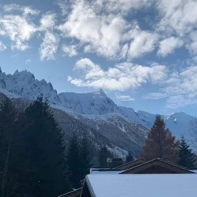 a view of a mountain with snow on the ground at Belle Vue Des Praz in Chamonix-Mont-Blanc