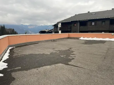 a large parking lot in front of a house at Grand Morillon-309 Appart vue pistes- 5 pers in Morillon