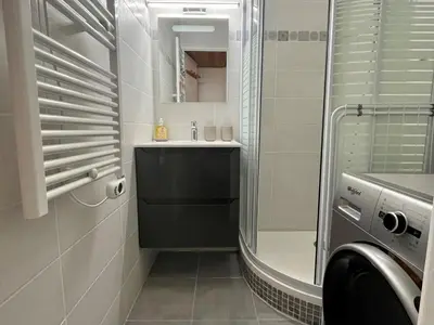 a small bathroom with a sink and a mirror at Studio rénové avec cabine et balcon au centre de Flaine - FR-1-425-196 in Arâches-la-Frasse