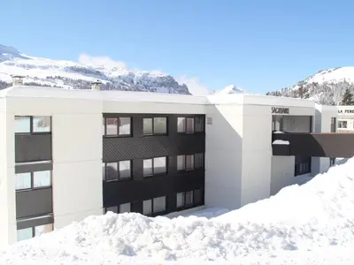 a snow covered building with the name of a ski resort at Studio rénové avec cabine et balcon au centre de Flaine - FR-1-425-196 in Arâches-la-Frasse