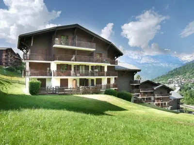 a table and chairs on a balcony with a view at Studio La Piste B71 by Interhome in Saint-Gervais-les-Bains