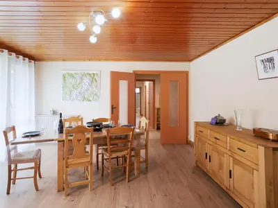 a kitchen and dining room with a table and chairs at Apartment Le Nerey-2 by Interhome in Saint-Gervais-les-Bains