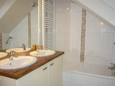 a bathroom with three sinks and a bath tub at Apartment Le Domaine de Crespin by Interhome in Saint-Gervais-les-Bains
