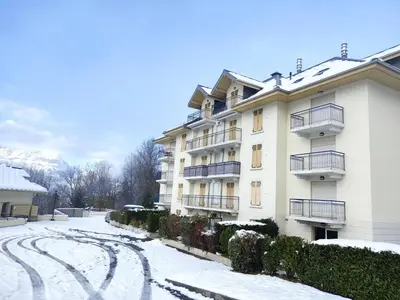a white building with snow on the ground at Apartment Le Domaine de Crespin by Interhome in Saint-Gervais-les-Bains