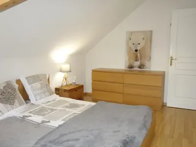 a bedroom with a bed and a painting of a dog at Apartment Le Domaine de Crespin by Interhome in Saint-Gervais-les-Bains
