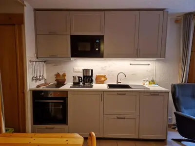a kitchen with a sink and a stove top oven at Apartment Husky in Saint-Gervais-les-Bains