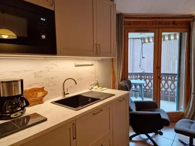 a kitchen with a sink and a counter top at Apartment Husky in Saint-Gervais-les-Bains