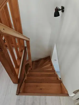 a building with a balcony on the side of it at Beau duplex lumineux à la montagne Nice flat just underneath MtBlanc in Les Houches